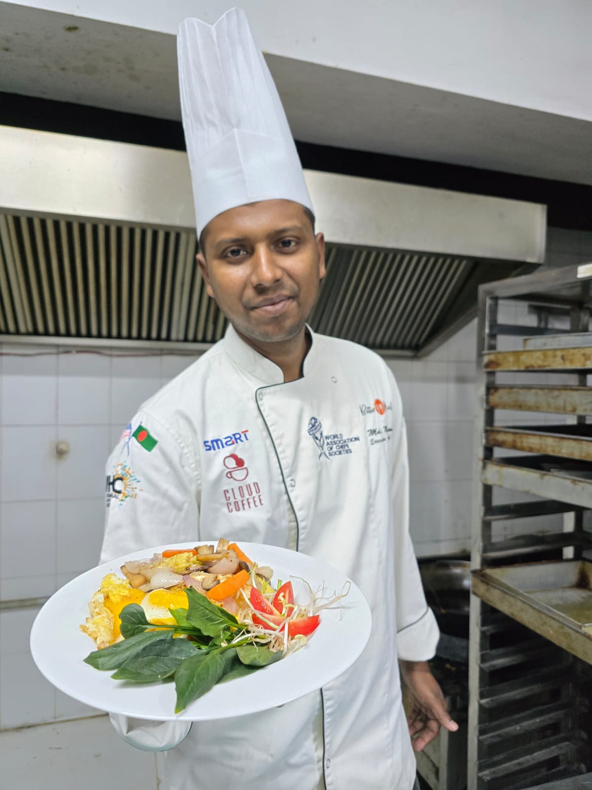 Chef Munna presenting a plated breakfast or brunch dish in a professional kitchen